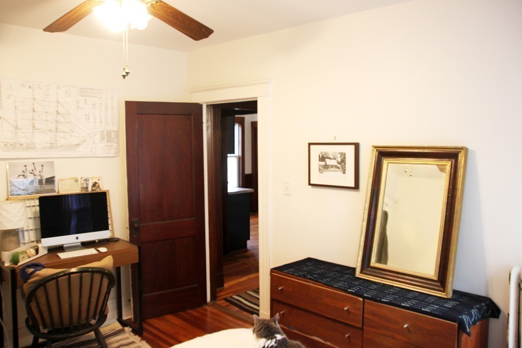 80 Aldrich Street, Unit 2 Boston, MA 02131 - Photo 16 of 20 a living room with furniture and a flat screen tv