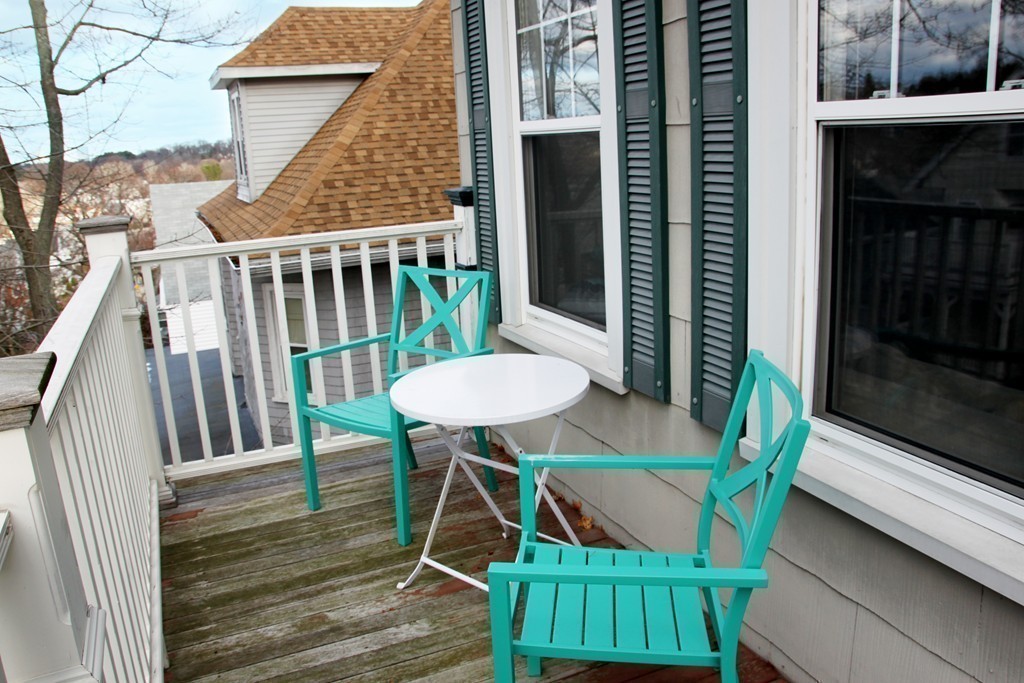 80 Aldrich Street, Unit 2 Boston, MA 02131 - Photo 19 of 20 a view of a balcony with table and chairs
