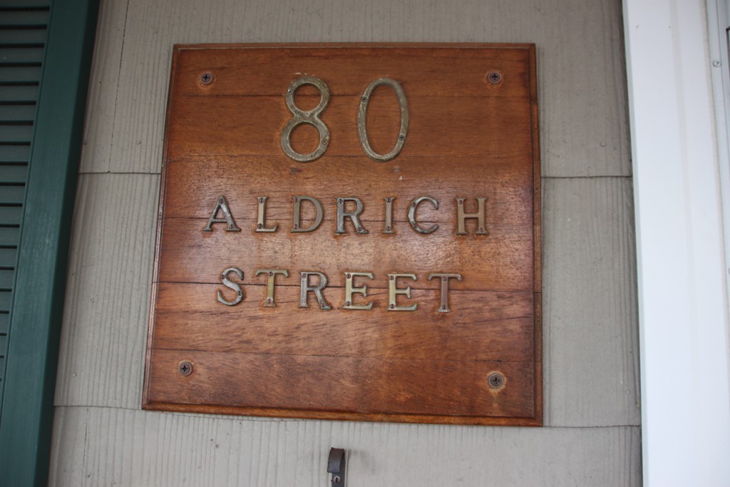 80 Aldrich Street, Unit 2 Boston, MA 02131 - Photo 20 of 20 a sign broad on a wooden wall