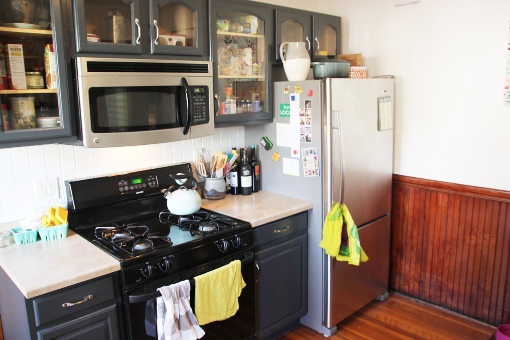 80 Aldrich Street, Unit 2 Boston, MA 02131 - Photo 4 of 20 a kitchen with a stove and a refrigerator
