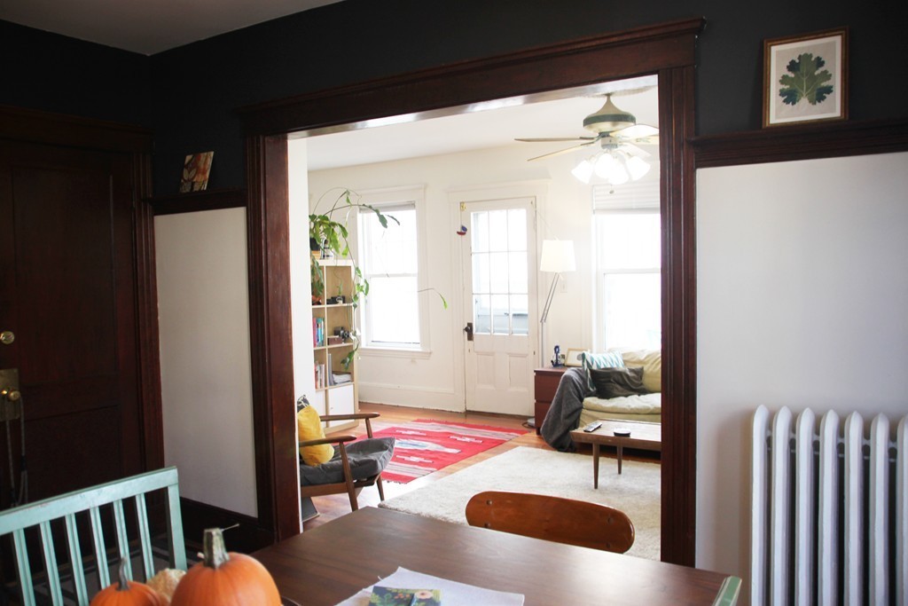 80 Aldrich Street, Unit 2 Boston, MA 02131 - Photo 7 of 20 a bedroom with furniture and a large window