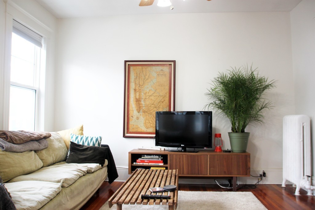 80 Aldrich Street, Unit 2 Boston, MA 02131 - Photo 10 of 20 a living room with furniture and a flat screen tv
