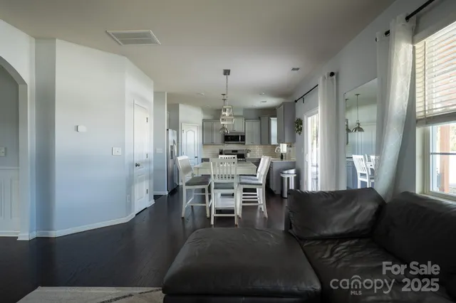 a dining room with furniture and window