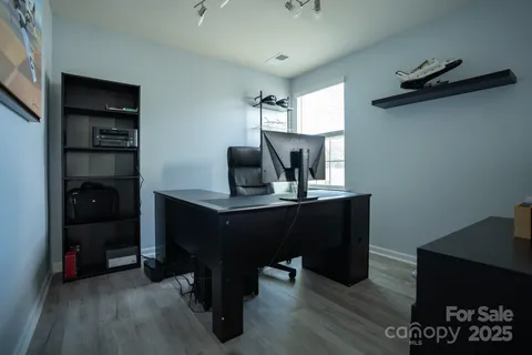 a room with furniture and wooden floor
