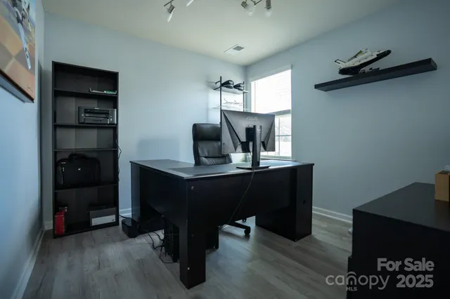 a room with furniture and wooden floor