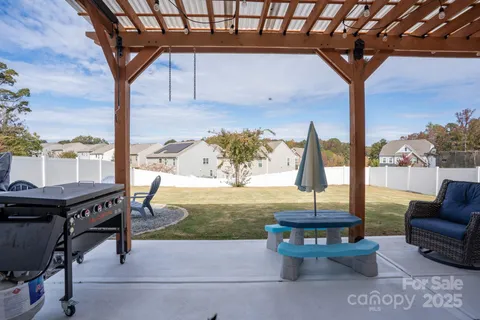 a view of a swimming pool with lounge chairs