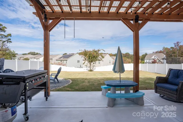 a view of a swimming pool with lounge chairs