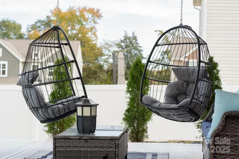 a view of a white house with swimming pool in front of it