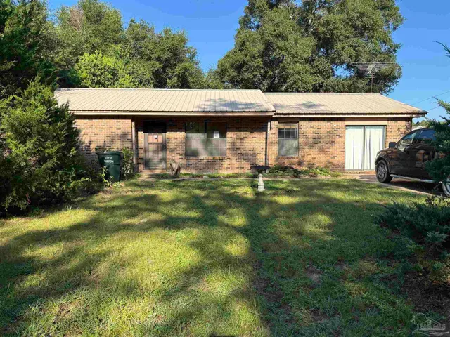 a backyard of a house with lots of green space