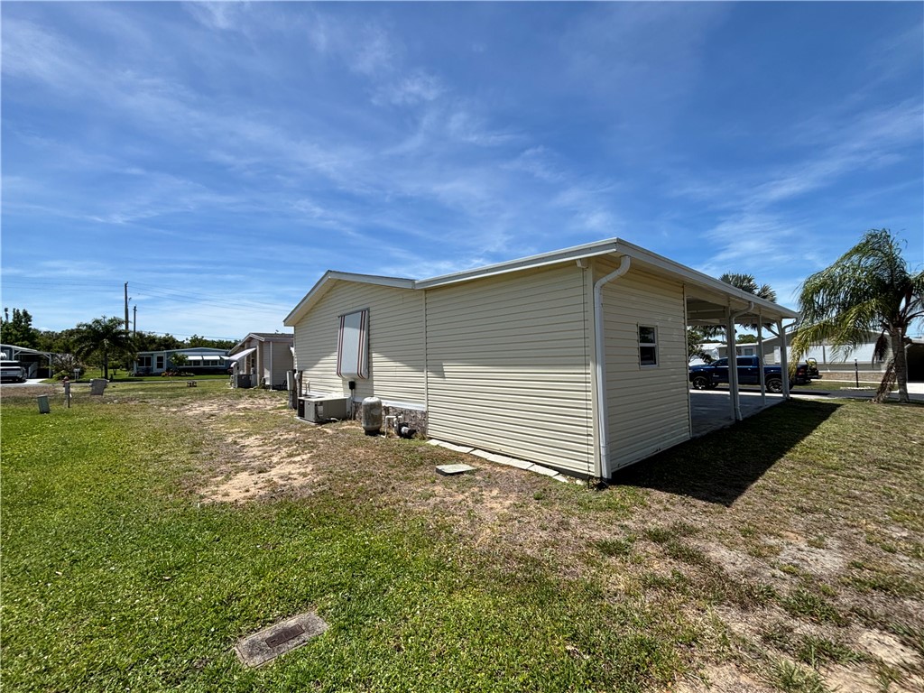 6171 98th Road Sebastian, FL 32958 - Photo 5 of 14 a view of a house with backyard