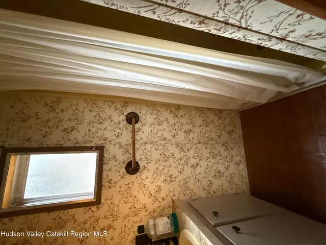 a bathroom with a toilet and shower