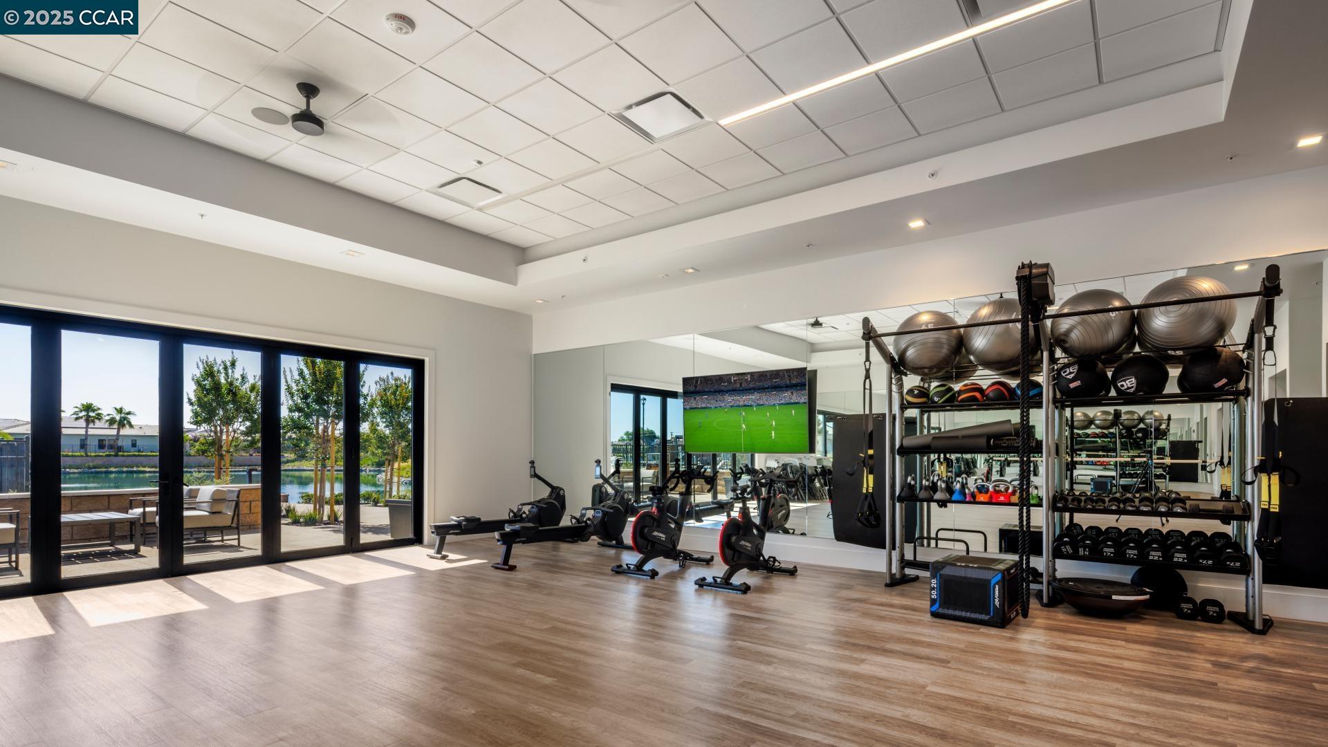 3172 Boca Way Tracy, CA 95377 - Photo 19 of 35 a view of a room with gym equipment and a large window