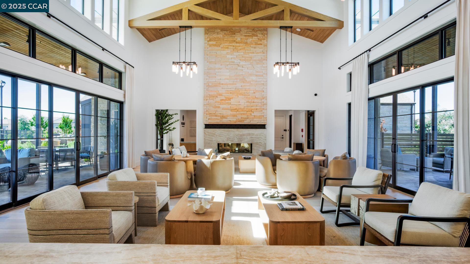 3172 Boca Way Tracy, CA 95377 - Photo 21 of 35 a living room with fireplace furniture and a floor to ceiling window