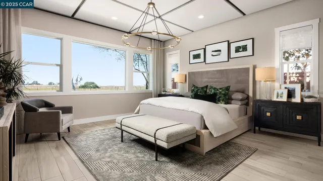 a spacious bedroom with a bed and a couch