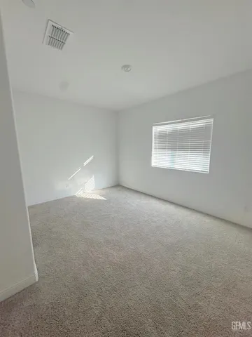 an empty room with a empty space and windows