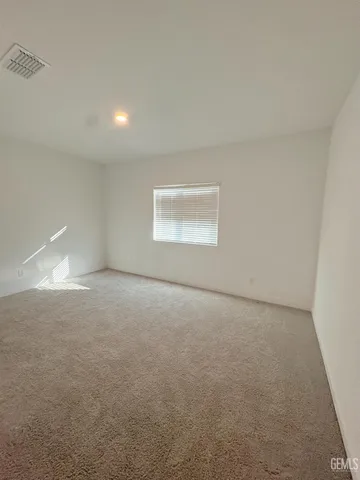 an empty room with a empty space and windows