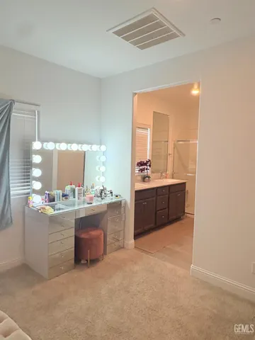 a kitchen with stainless steel appliances a sink and a refrigerator