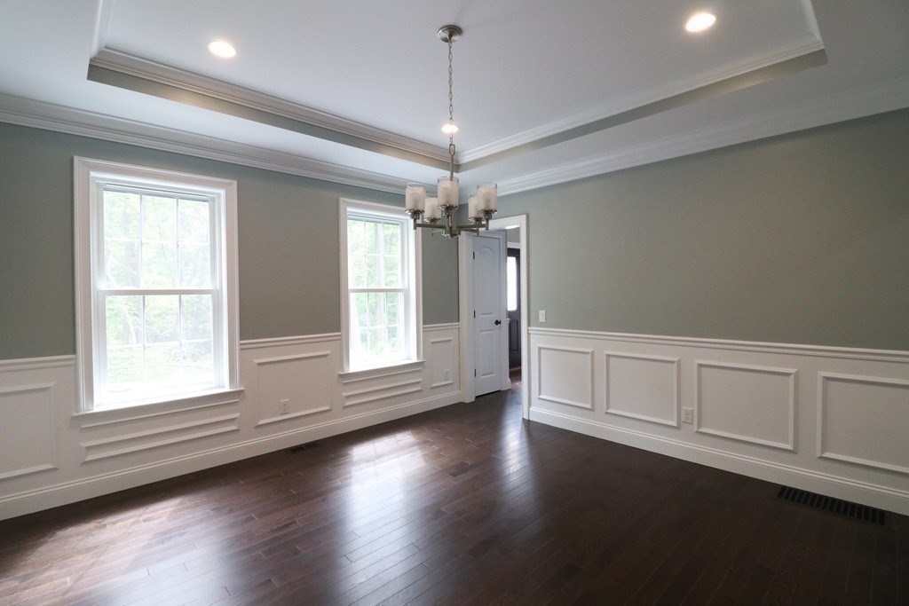 5 West River Street Upton, MA 01568 - Photo 18 of 37 a view of an empty room with wooden floor and a window