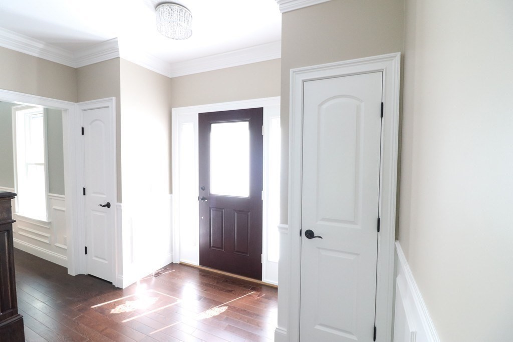 5 West River Street Upton, MA 01568 - Photo 23 of 37 a view of an entryway with wooden floor