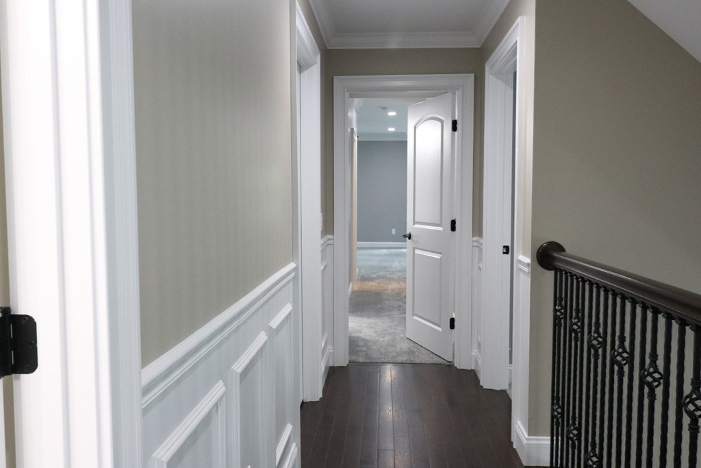 5 West River Street Upton, MA 01568 - Photo 28 of 37 a view of a hallway with wooden floor and closet