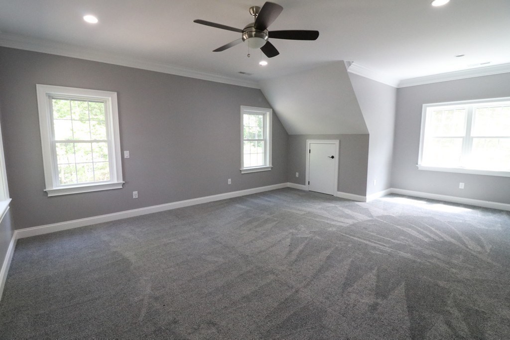 5 West River Street Upton, MA 01568 - Photo 30 of 37 an empty room with windows and fan