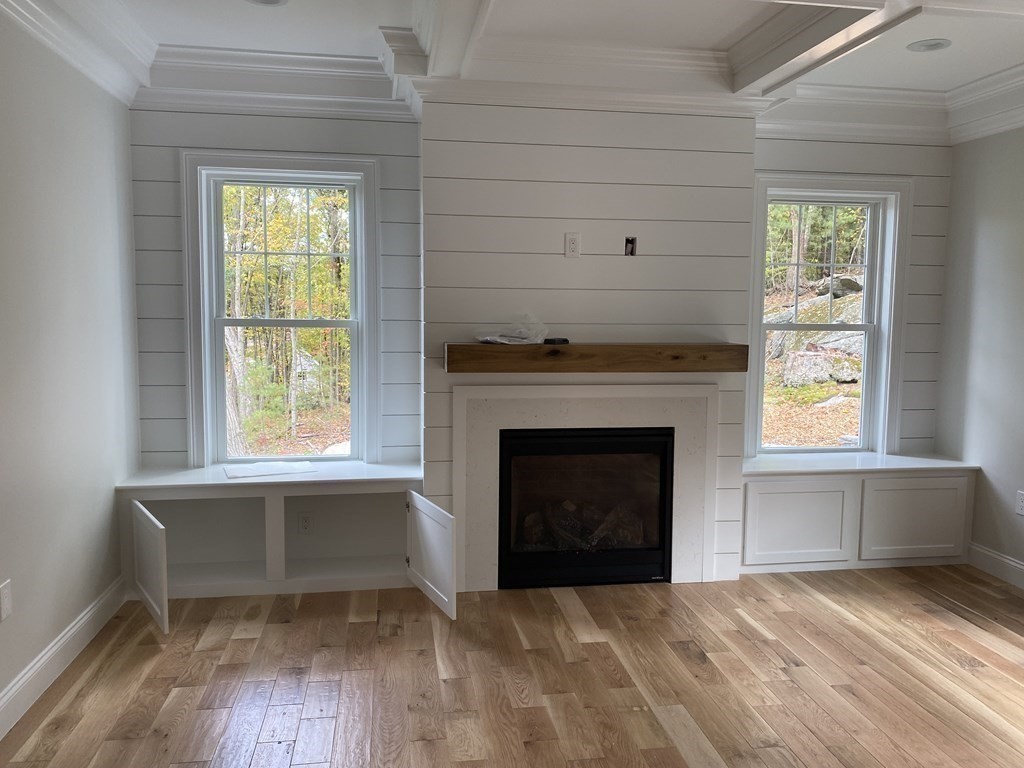 5 West River Street Upton, MA 01568 - Photo 37 of 37 an empty room with windows and fireplace