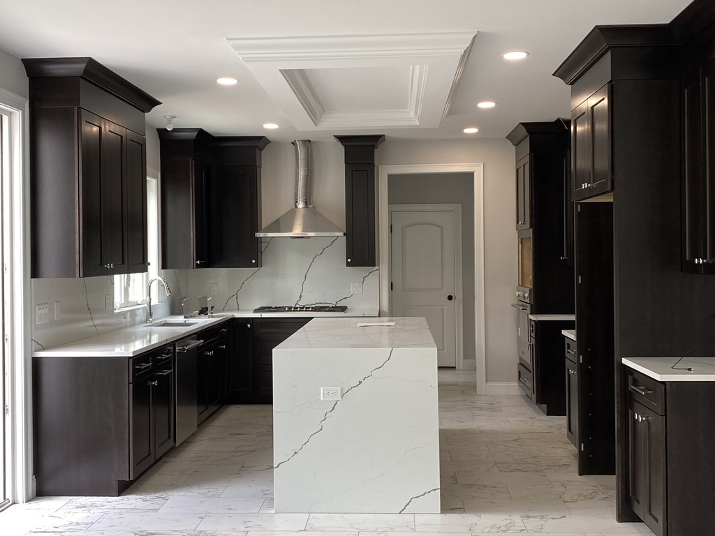 5 West River Street Upton, MA 01568 - Photo 4 of 37 a bathroom with a sink a toilet and mirror