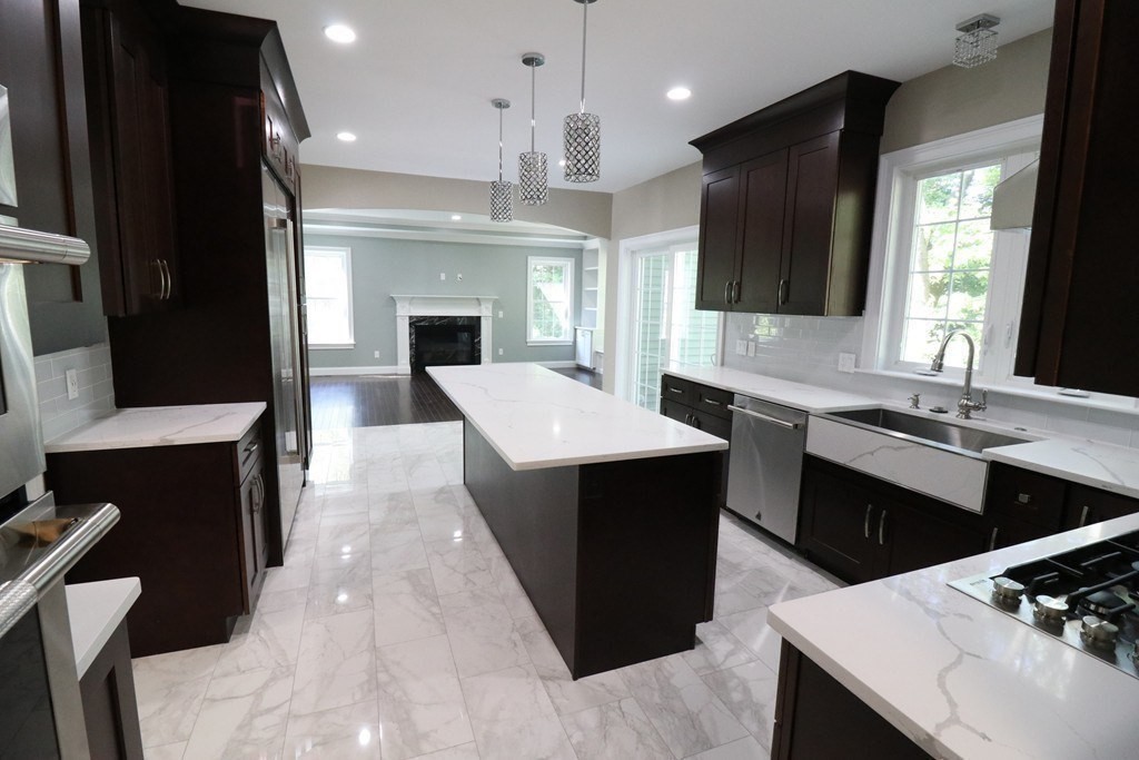5 West River Street Upton, MA 01568 - Photo 6 of 37 a large kitchen with cabinets and counter space