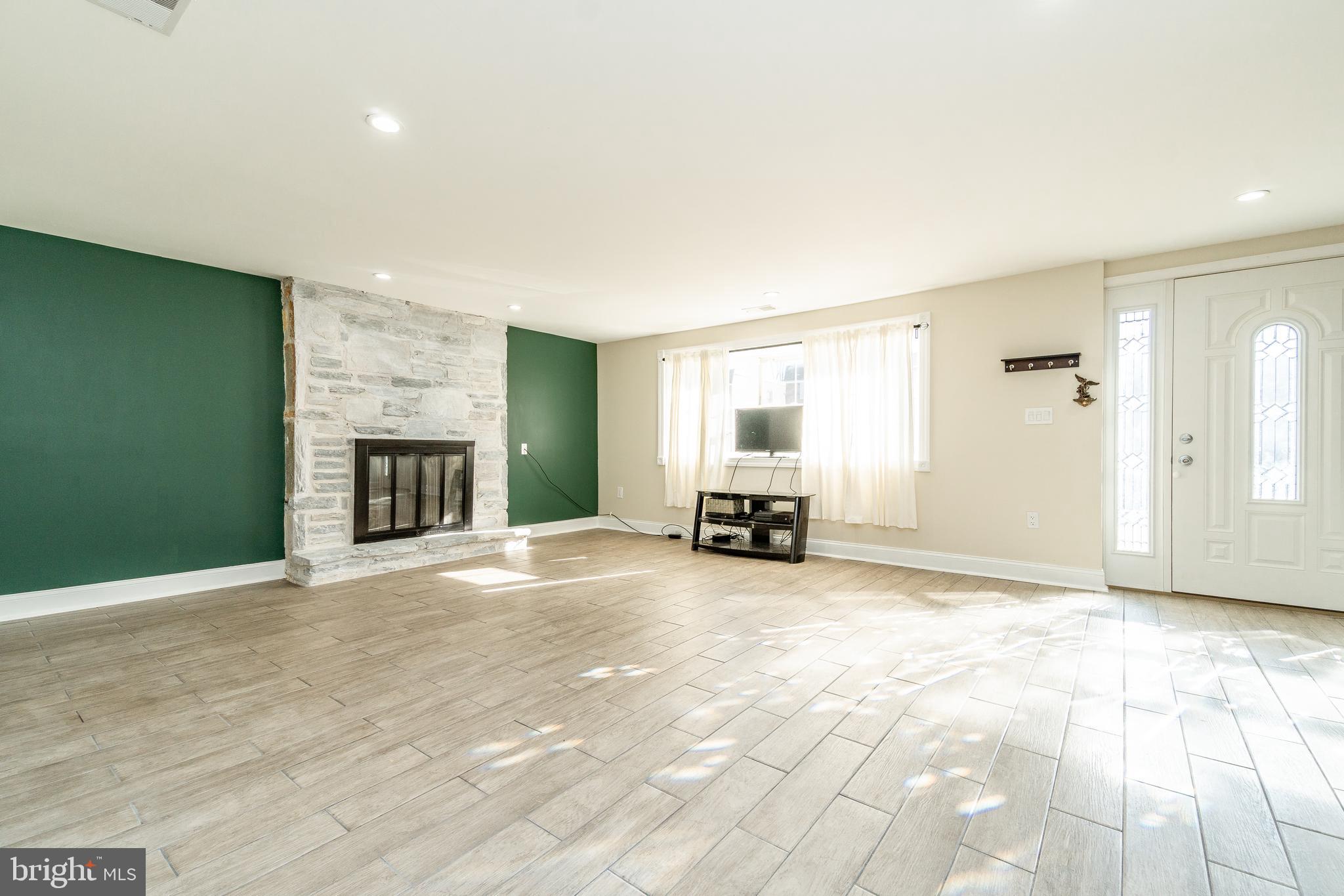 631 Renz Street Philadelphia, PA 19128 - Photo 6 of 40 Living Room with wood burning fireplace