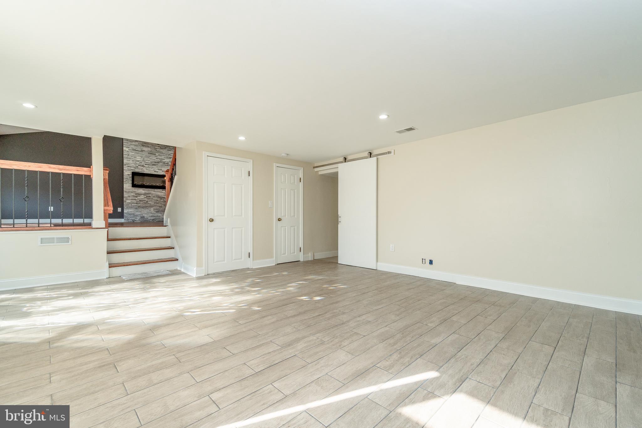 631 Renz Street Philadelphia, PA 19128 - Photo 10 of 40 L/R with access to bsmt, half bath & laundry room