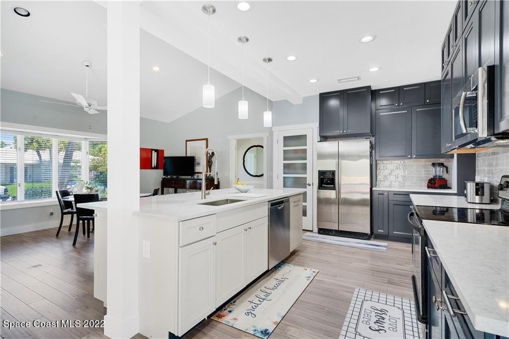 Undisclosed Address Vero Beach, FL 32963 - Photo 13 of 36 a kitchen with counter top space cabinets and stainless steel appliances