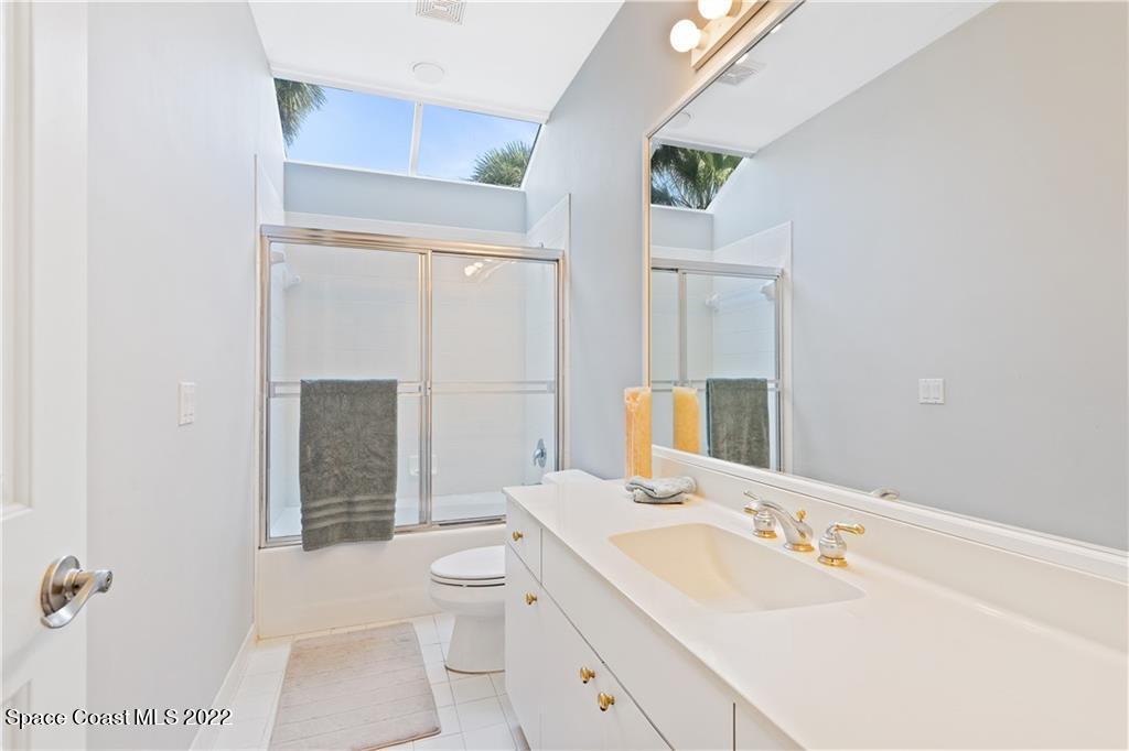 Undisclosed Address Vero Beach, FL 32963 - Photo 28 of 36 a bathroom with a sink a toilet and shower