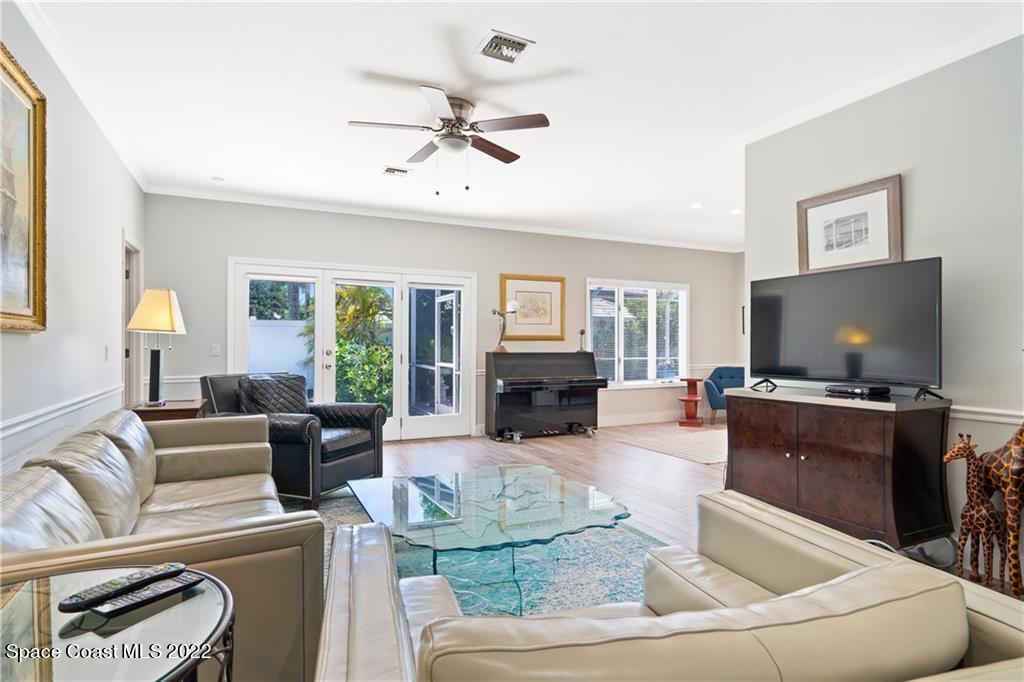 Undisclosed Address Vero Beach, FL 32963 - Photo 8 of 36 a living room with furniture and a flat screen tv