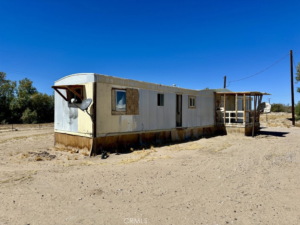 46123 Fairview Road Newberry Springs, CA 92365 - Photo 10 of 15 a front view of a house with a yard
