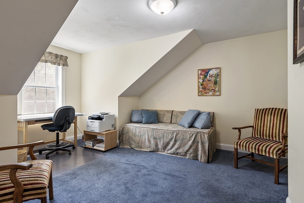 19 Marble Farm Road, Unit 19 Maynard, MA 01754 - Photo 26 of 42 a living room with furniture and a window