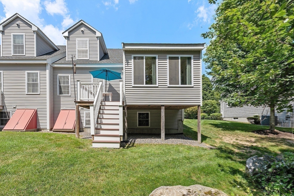 19 Marble Farm Road, Unit 19 Maynard, MA 01754 - Photo 28 of 42 a view of a house with a yard