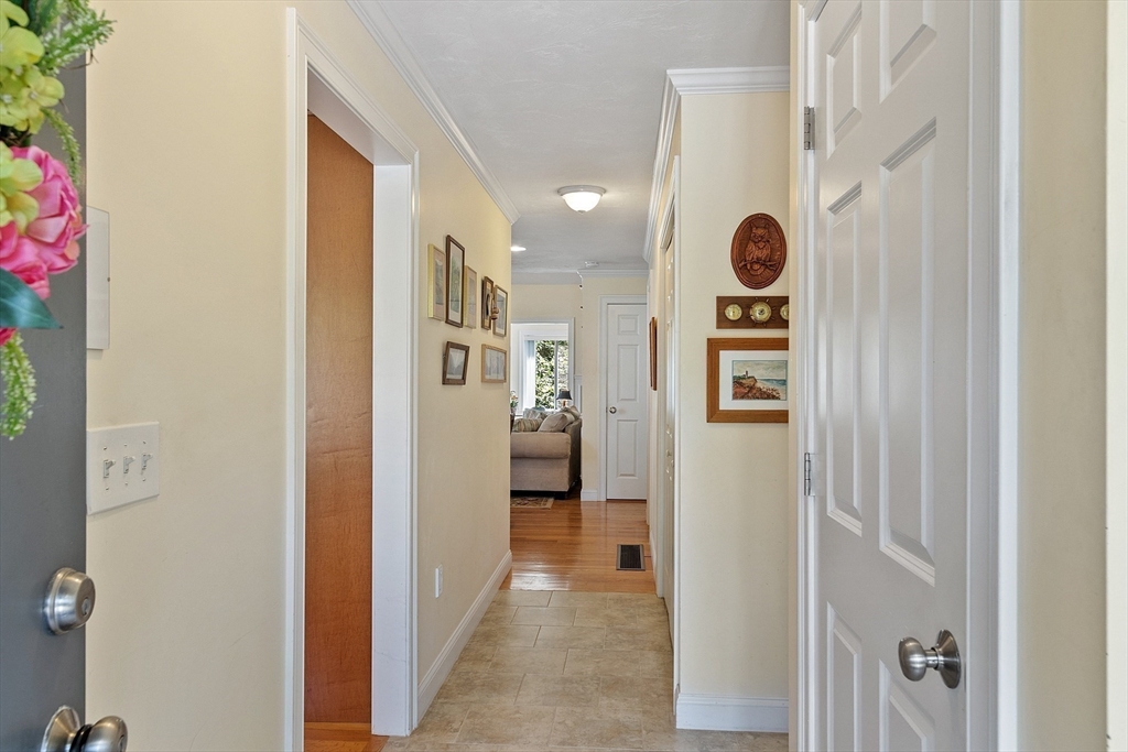 19 Marble Farm Road, Unit 19 Maynard, MA 01754 - Photo 3 of 42 a view of a hallway with dining area