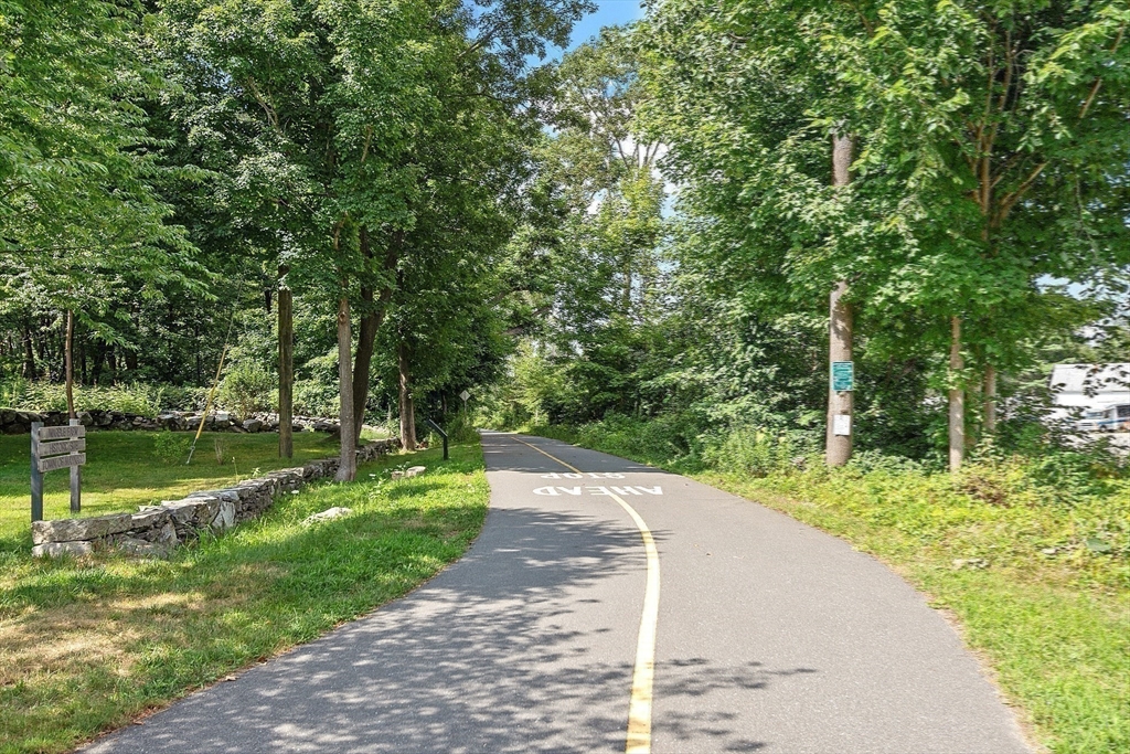 19 Marble Farm Road, Unit 19 Maynard, MA 01754 - Photo 37 of 42 a view of a lake with a yard