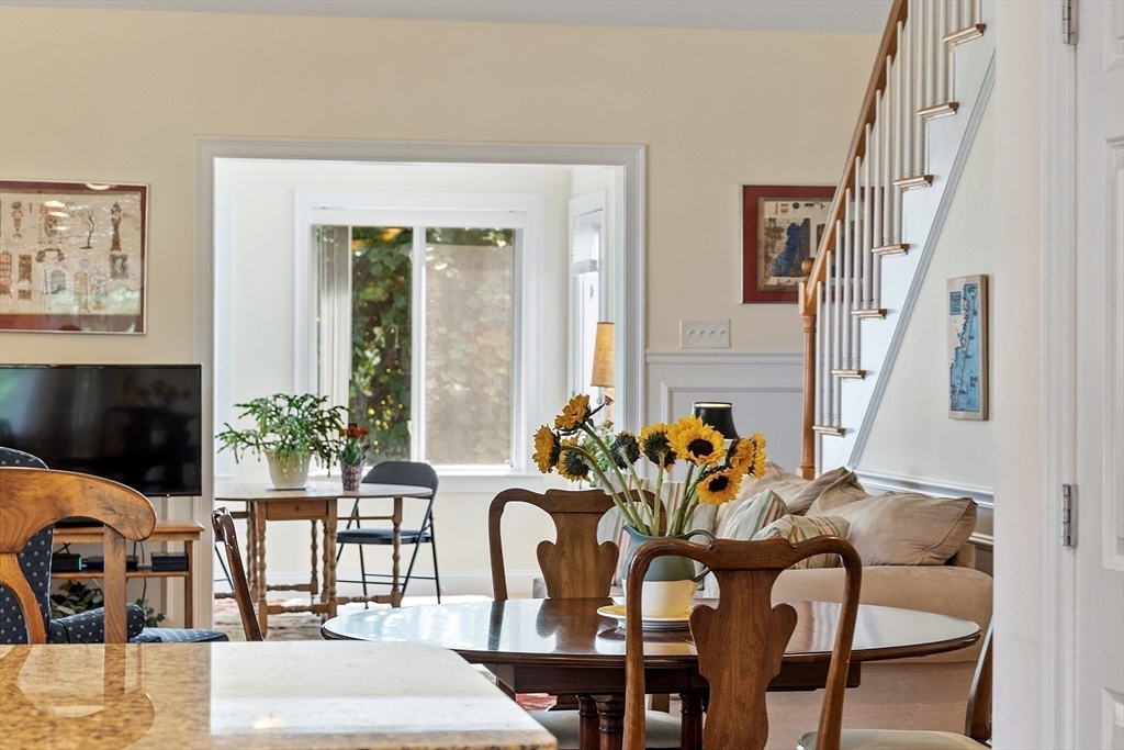 19 Marble Farm Road, Unit 19 Maynard, MA 01754 - Photo 9 of 42 a view of a dining room with furniture and a potted plant