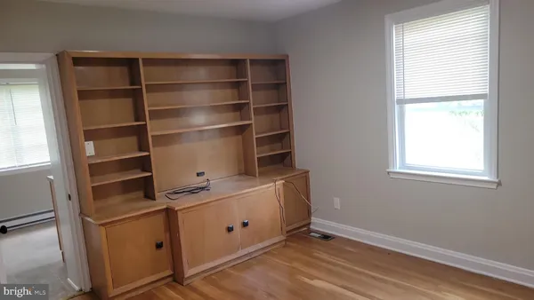 a room with cabinets and window