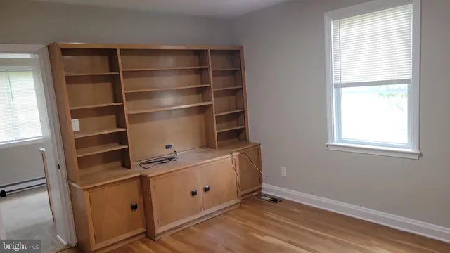 a room with cabinets and window
