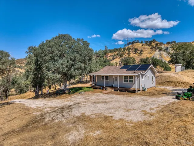 a view of a house with a snow in the yard