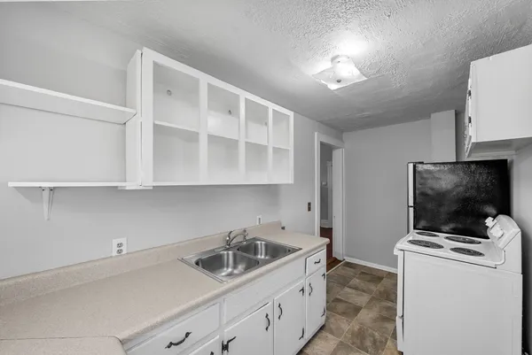 a kitchen with a stove and a microwave