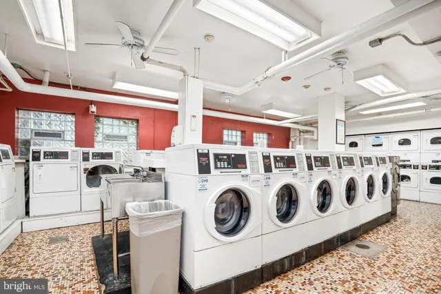 a utility room with multiple dryer and washer