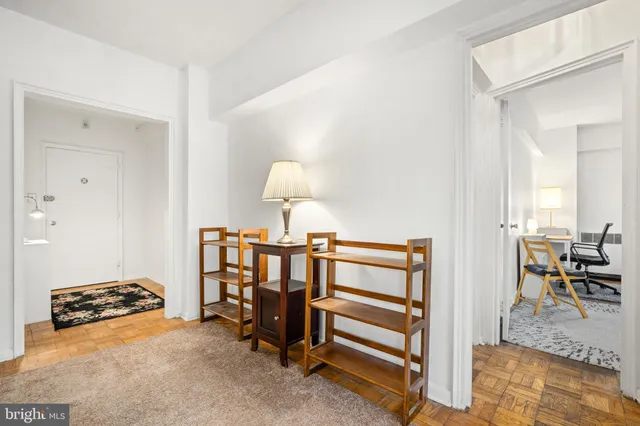 a view of a room with furniture and a table