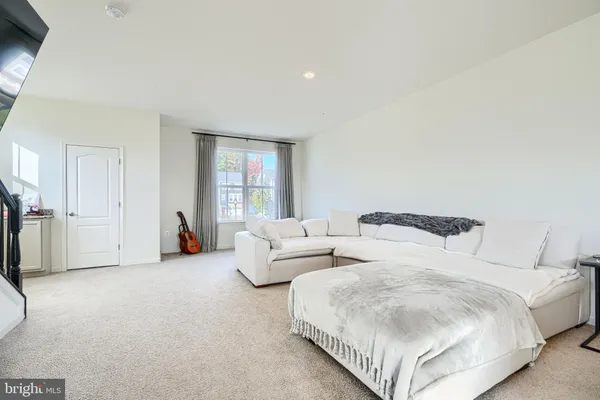 a bedroom with two beds and a large window