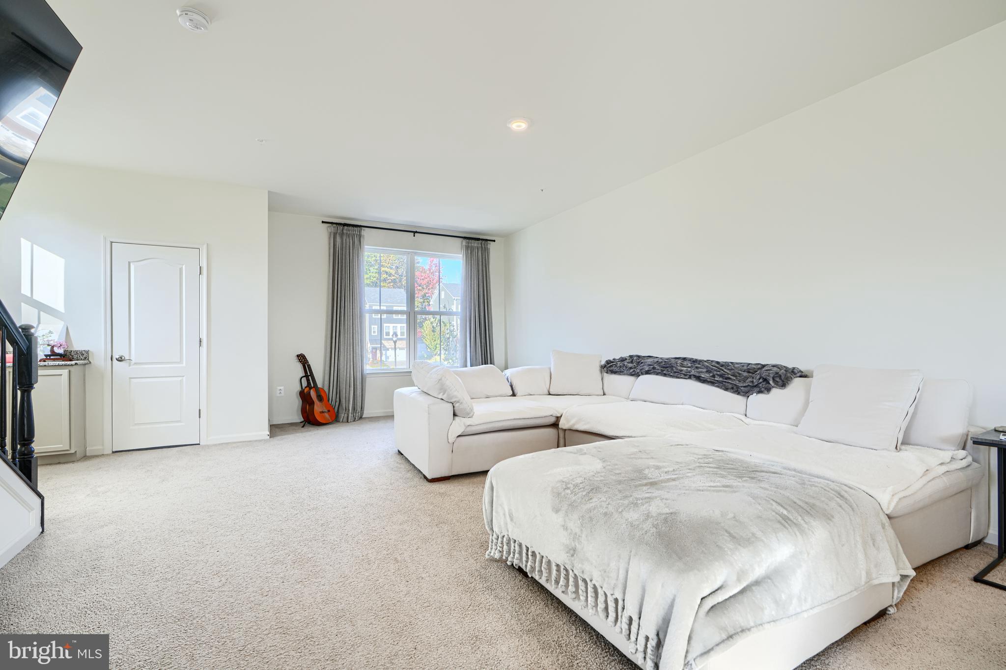 7141 Millstone Road Hanover, MD 21076 - Photo 17 of 32 a bedroom with two beds and a large window
