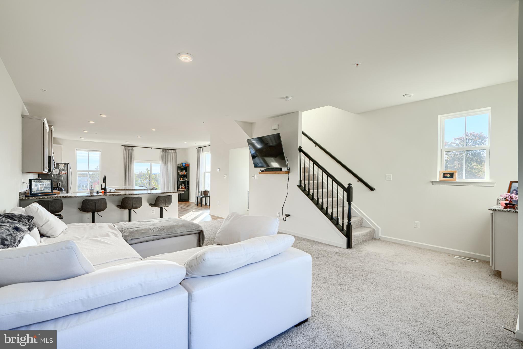 7141 Millstone Road Hanover, MD 21076 - Photo 18 of 32 a living room with furniture and stairs
