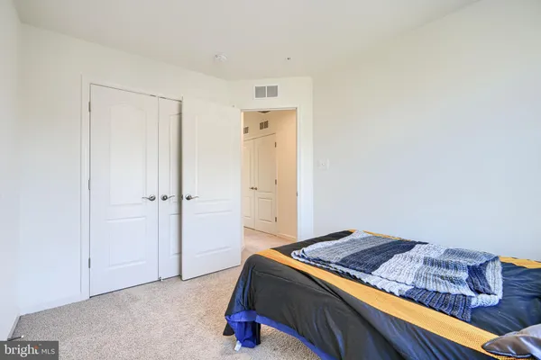 a bedroom with a bed and closet
