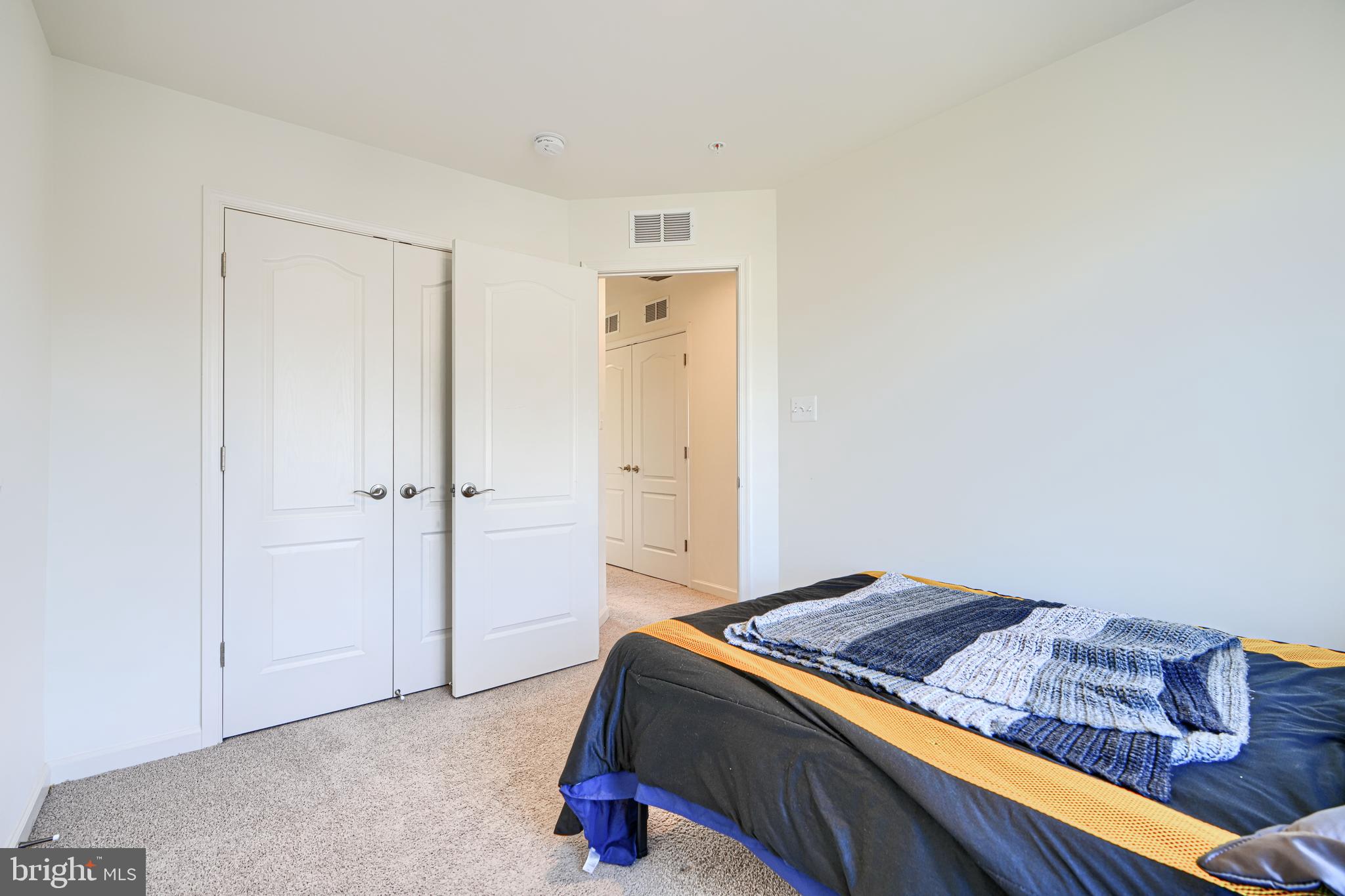7141 Millstone Road Hanover, MD 21076 - Photo 22 of 32 a bedroom with a bed and closet